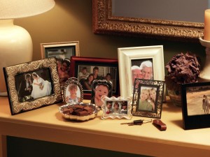 TS-78486658_collection-of-framed-pictures-on-console_s4x3.jpg.rend.hgtvcom.1280.960