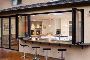 Open-kitchen-with-bar-and-bar-stools-outside